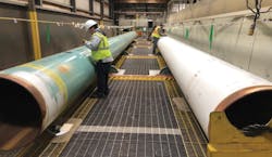 ShawCor inspected test pipes at its internal coating plant in Camrose, Alta. (Fig. 4). ShawCor inspected test pipes at its internal coating plant in Camrose, Alta. (Fig. 4).