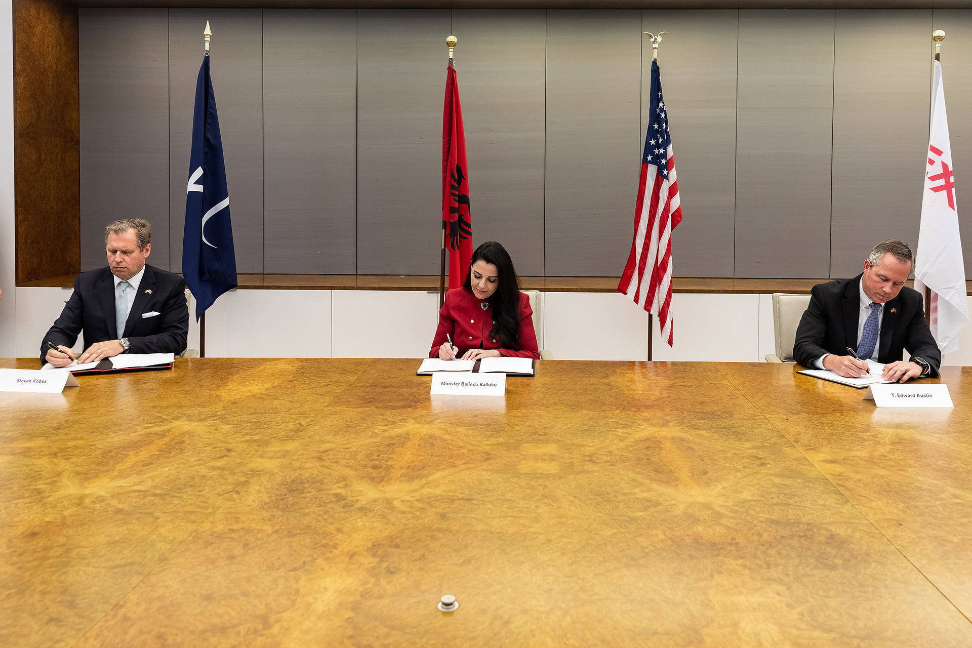Signing the MOU, from left to right, Steven Kobos, president and chief executive officer, Excelerate Energy; Belinda Balluku, Minister of Infrastructure and Energy; T. Edward Austin, vice-president, ExxonMobil LNG Market Development Inc.