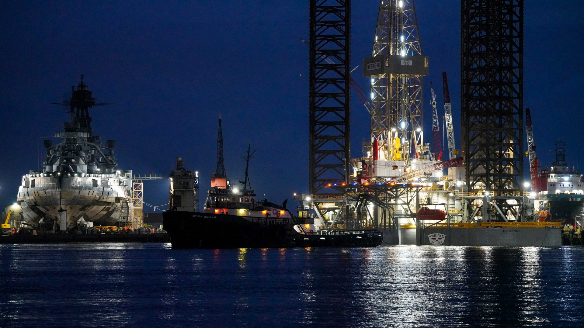 White Fleet Drilling 400 jack-up drilling rig leaving shipyard in Galveston, Tex.