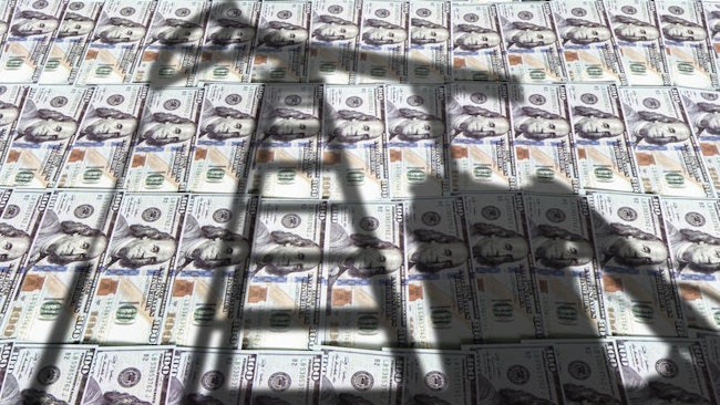 Pump jack on US US dollar notes,