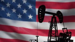 pumpjack over American flag pumpjack over American flag
