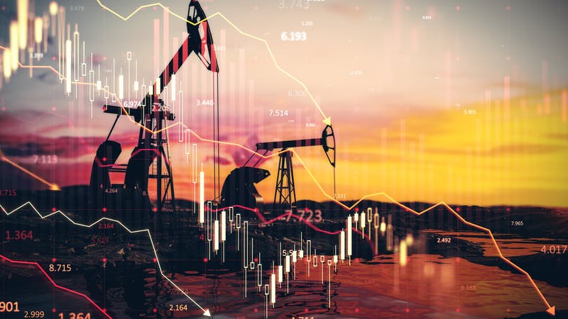 Oil pumpjacks at sunset with financial charts overlay depicting market trends. Concept of oil economy, stock market, and trade fluctuations