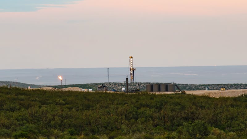 Drilling Rig and Oil Facility in the Permian Basin Texas with flare