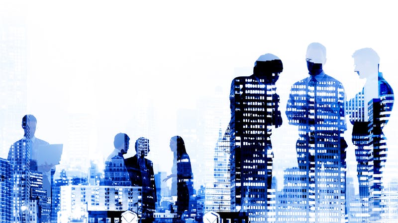 employees against backdrop of office buildings