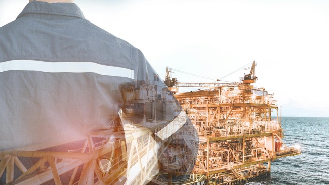 Double exposure of engineer man holding safety hat, offshore oil and gas platform background
