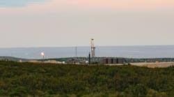 Drilling rig and oil facility in the Permian basin Drilling rig and oil facility in the Permian basin