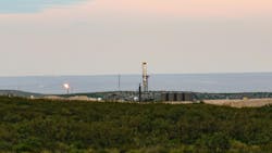 Drilling rig and oil facility in the Permian basin Drilling rig and oil facility in the Permian basin