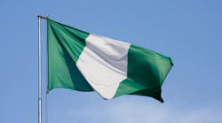 Flag of Nigeria on a background blue sky Flag of Nigeria on a background blue sky