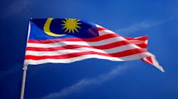 Malaysia's flag over blue sky Malaysia's flag over blue sky