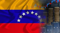 Venezuelan flag over oil barrels, market concept