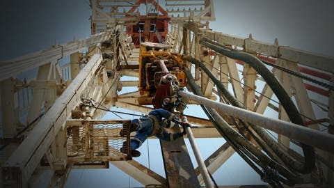 Oil worker on drilling rig