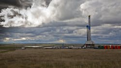 Drilling rig in North Dakota under cloudy sky Drilling rig in North Dakota under cloudy sky