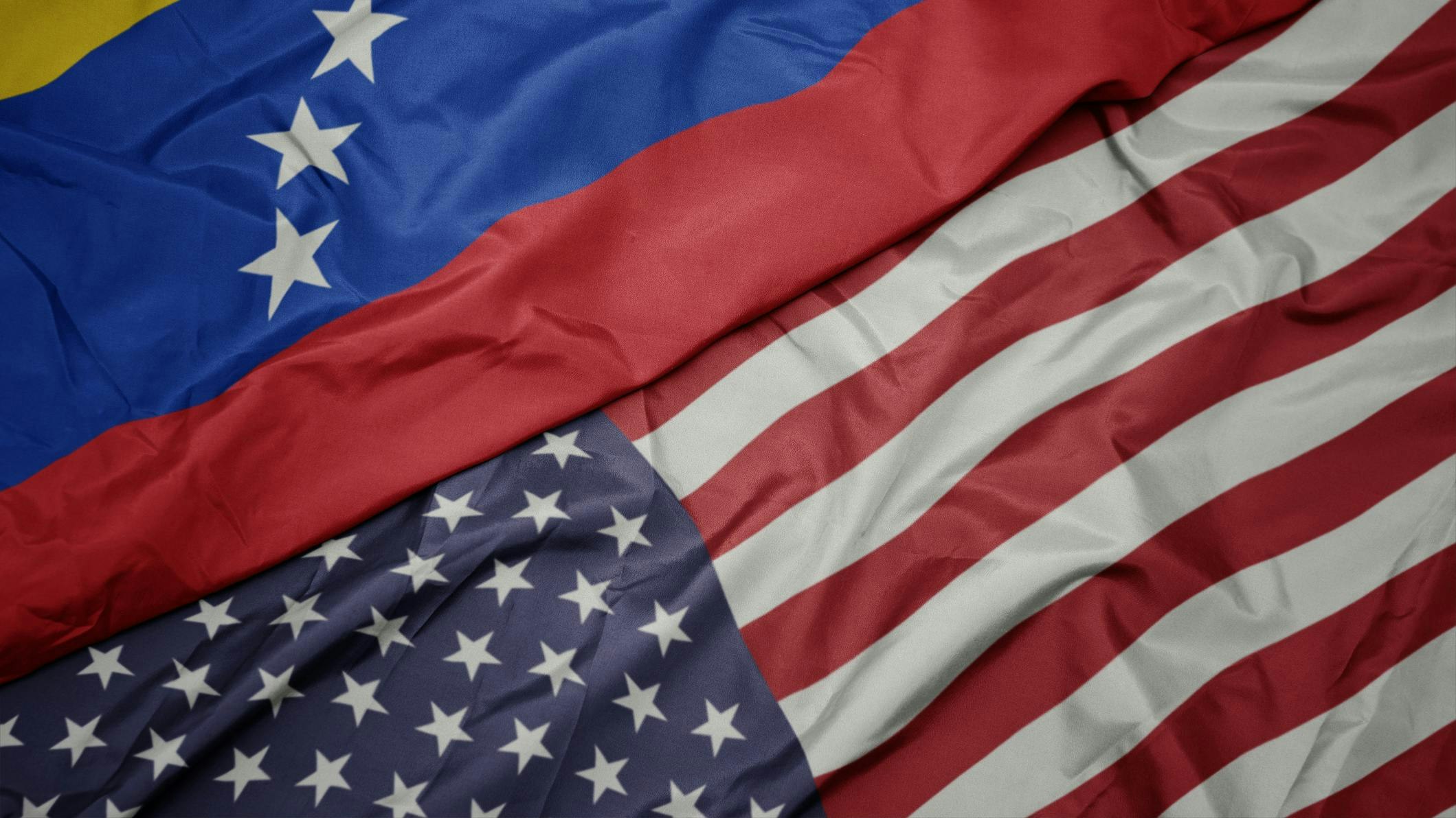 Split screen of Venezuela flag and US flag