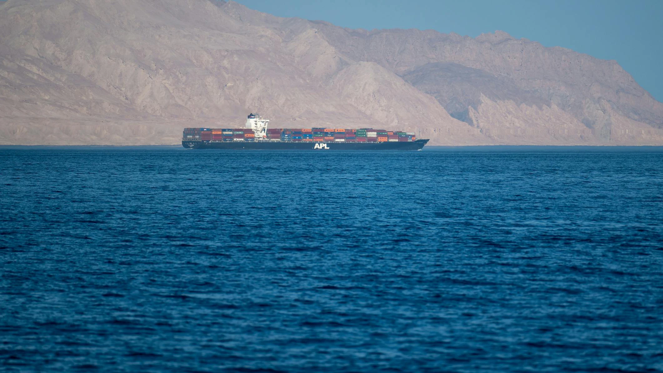 Sea container ship in the Strait of Hormuz, near Iranian coastline, 2021