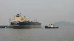 Russian oil tanker at dockyard with tugboat Russian oil tanker at dockyard with tugboat