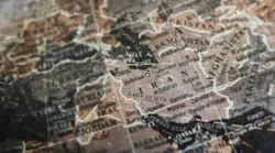 Iran map on vintage crack paper background Iran map on vintage crack paper background