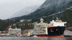 A heavy cargo vessel pulls a natural gas liquefaction module offshore British Columbia A heavy cargo vessel pulls a natural gas liquefaction module offshore British Columbia