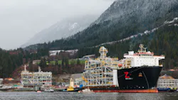 A heavy cargo vessel pulls a natural gas liquefaction module offshore British Columbia A heavy cargo vessel pulls a natural gas liquefaction module offshore British Columbia