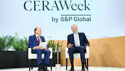 two men in suits seated for a leadership discussion two men in suits seated for a leadership discussion