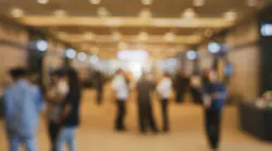 blurred photo of exhibition hall attendees blurred photo of exhibition hall attendees