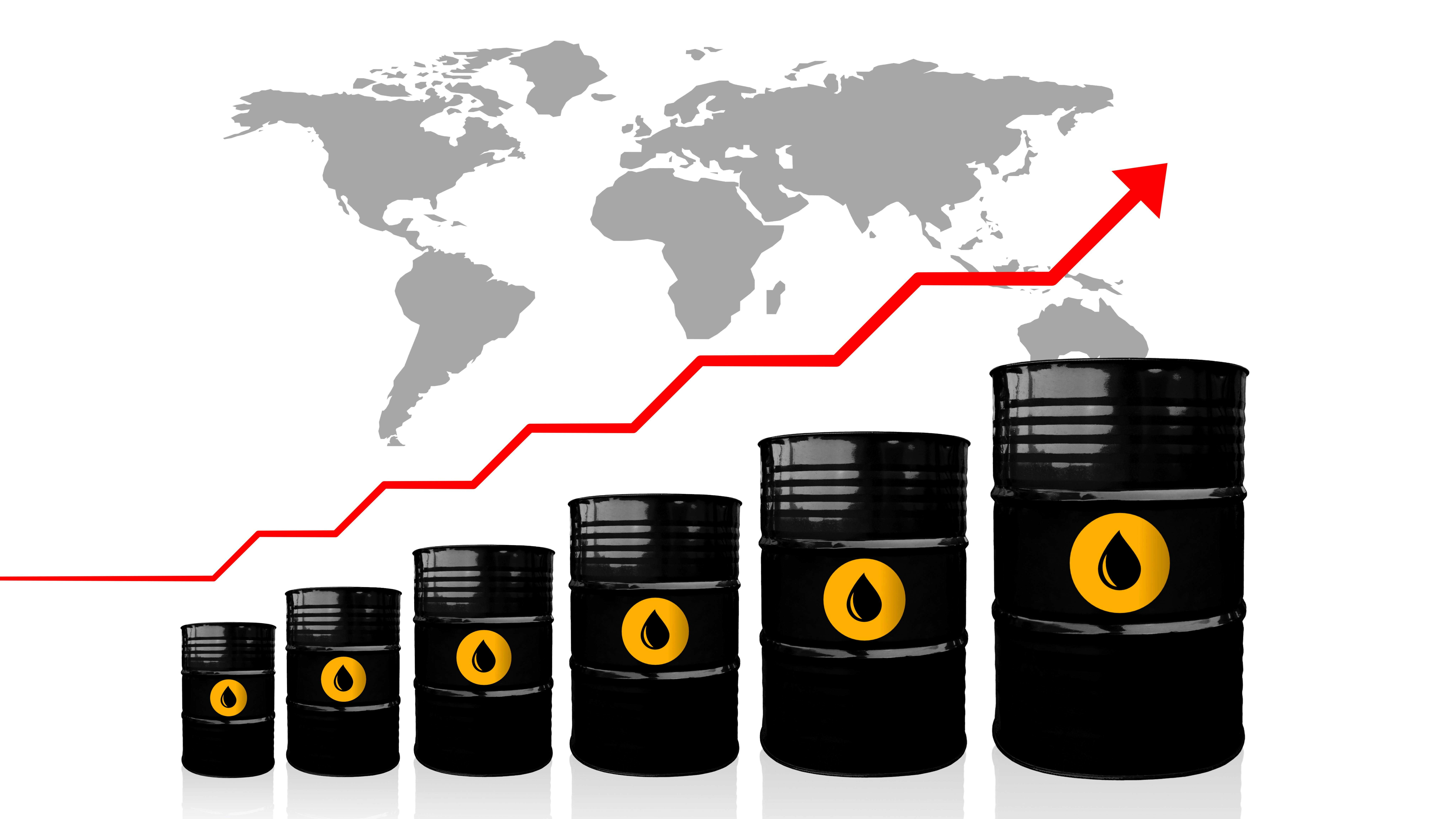Crude oil barrels increasing in size from left to right on a white background