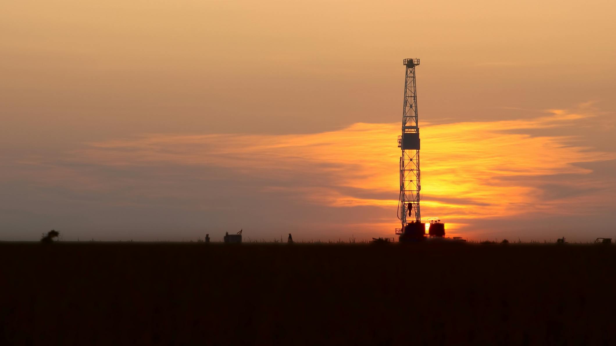 drilling rig onshore at sunset