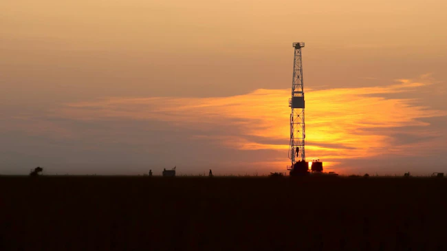 drilling rig onshore at sunset