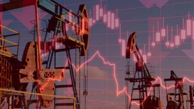 Silhouettes of industrial oil pump jacks operating at sunset, overlaid with red downward-trending lines and stock market charts