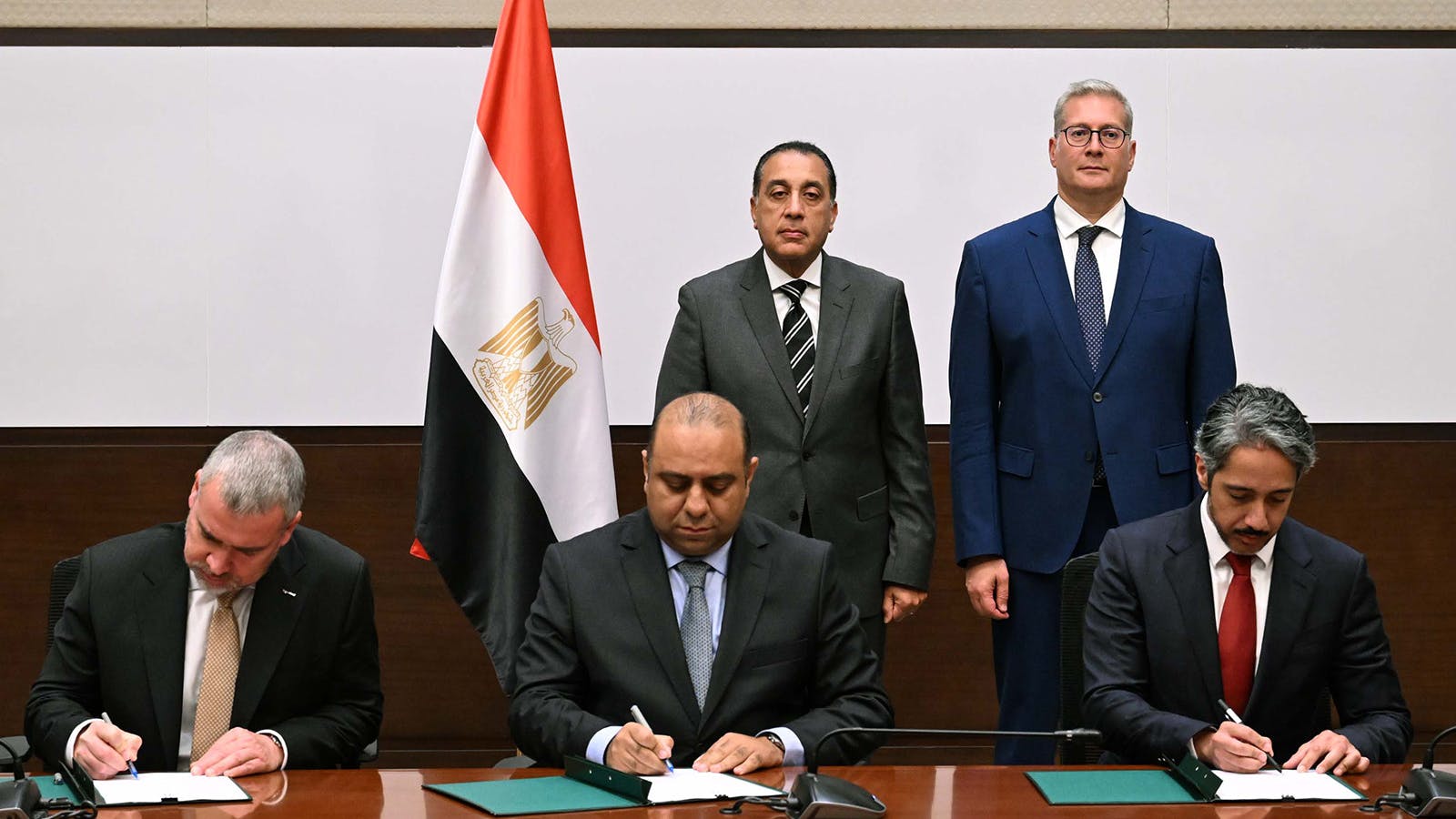 Representatives signing QatarEnergy, Egypt cooperation agreement
