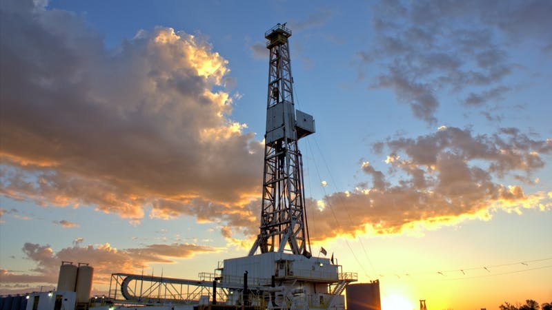 Drilling rig at sunset