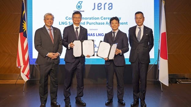 Petronas and JERA executives standing in a row
