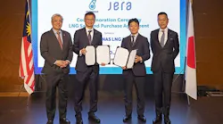 Petronas and JERA executives standing in a row Petronas and JERA executives standing in a row