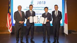 Petronas and JERA executives standing in a row Petronas and JERA executives standing in a row