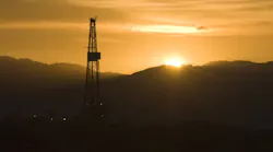 Drilling rig at sunset