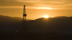 Drilling rig at sunset