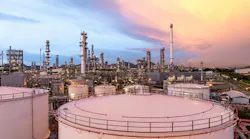 Aerial view oil and gas refinery plant at night.