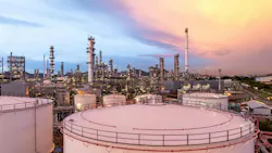 Aerial view oil and gas refinery plant at night.