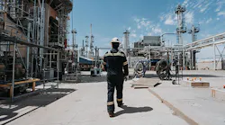 An employee walking through infrastructure at Montana Renewables' Great Falls renewable fuels production plant