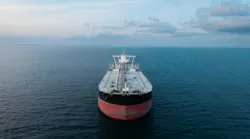 Aerial view of the front of a large crude oil tanker ship at sea.
