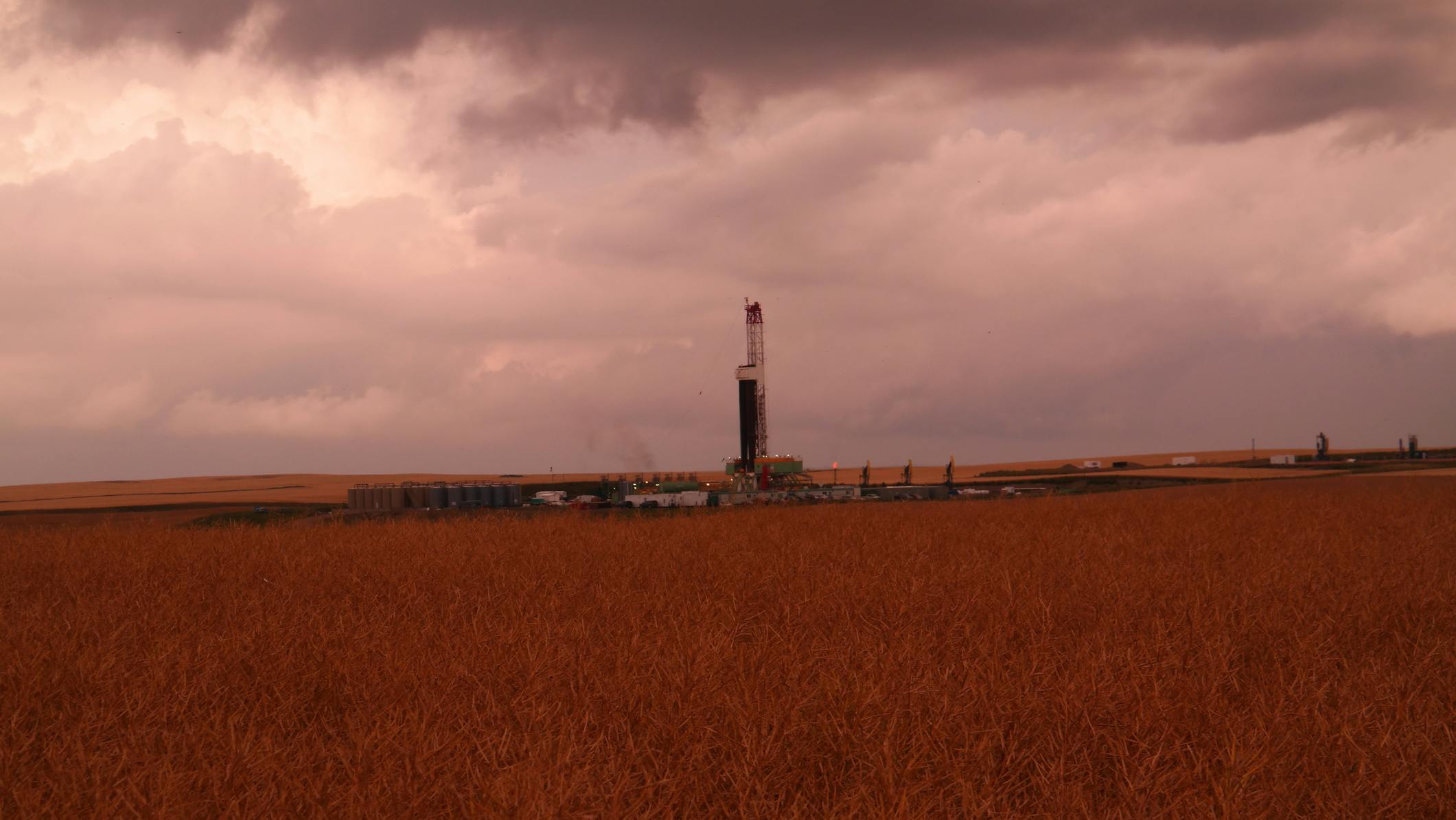 Drilling rig under cloudy sky