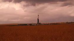 Drilling rig under cloudy sky