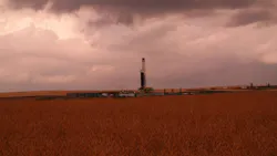 Drilling rig under cloudy sky