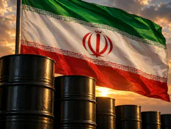 Flag of Iran billowing in wind over row of oil barrels.