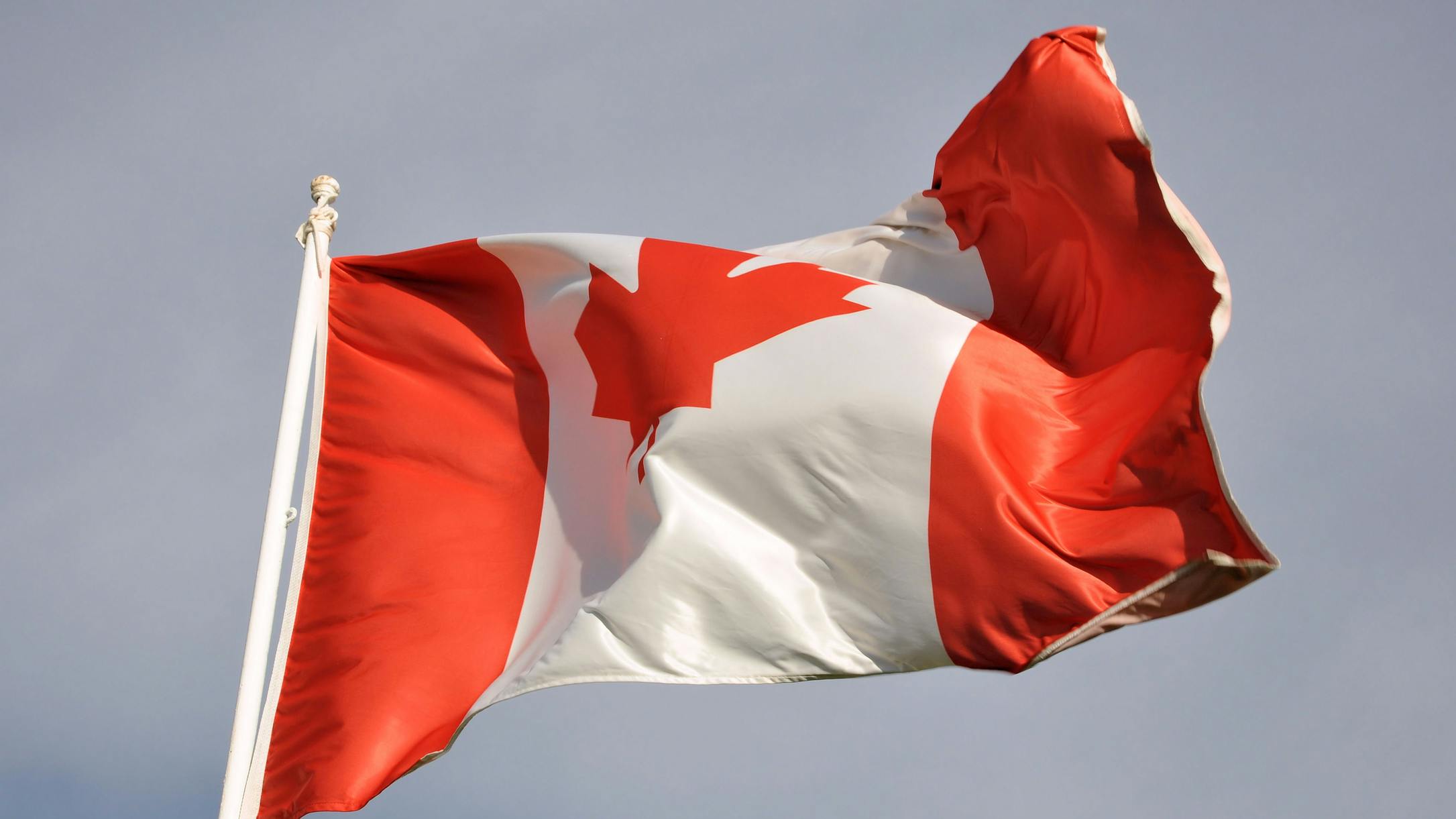 Canadian flag waving in wind