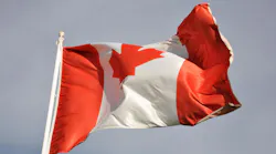 Canadian flag waving in wind