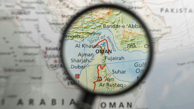 Map with Strait of Hormuz under a magnifying glass