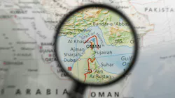 Map with Strait of Hormuz under a magnifying glass