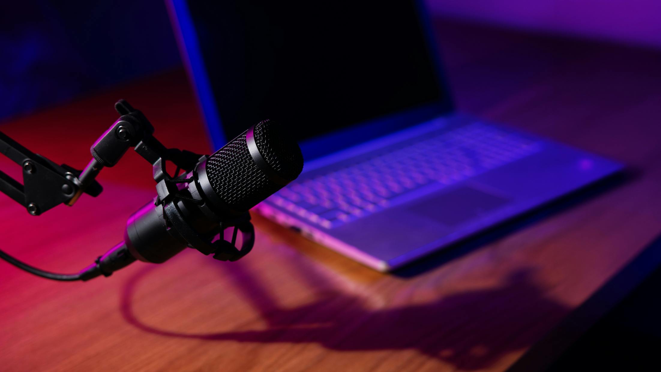 podcast mic on table with laptop