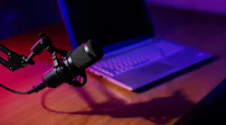 podcast mic on table with laptop