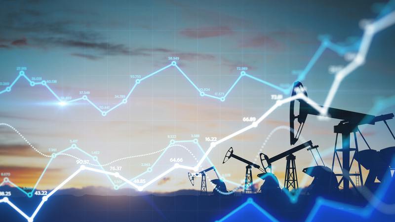 Line graph with oil pumpjacks in background.